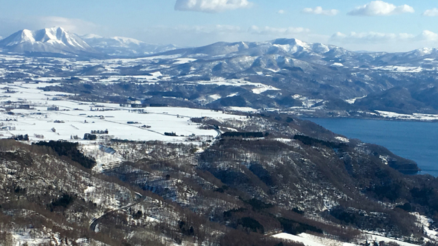 Japan's northern island of Hokkaido boasts world-class skiing through April and vistas of mountains and icy waters that yield the country's best scallops.