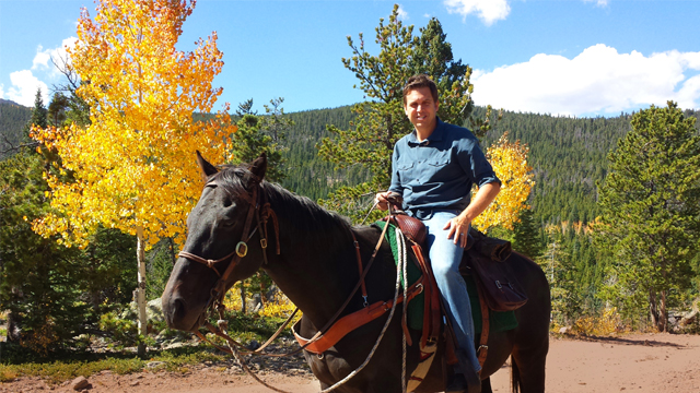 Rodman horseback riding in Colorado.