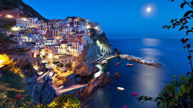The seaside village of Manarola in Cinque Terre, located on the rugged Italian Riviera coastline.