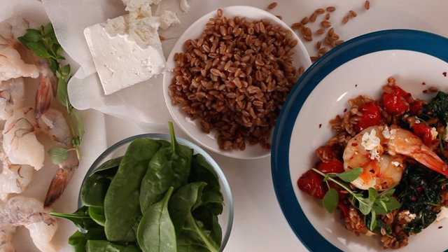 A Greek shrimp farro with greens dish