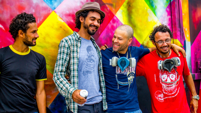 Brazilian artist Eduardo Kobra and crew stand in front of his "Tupac and Biggie Street Art Tribute" in Wynwood during Miami Art Basel in 2013.