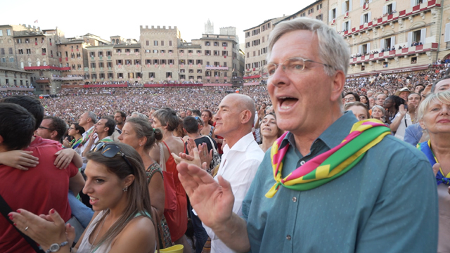 Rick cheers with the crowd at the Palio in Siena, Italy.