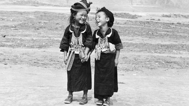 Two girls in traditional Hmong clothes