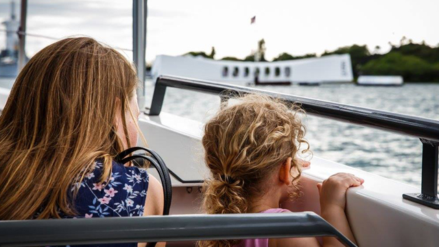 Family members of Raymond Haerry Sr. traveling to the USS Arizona Memorial in Pearl Harbor.