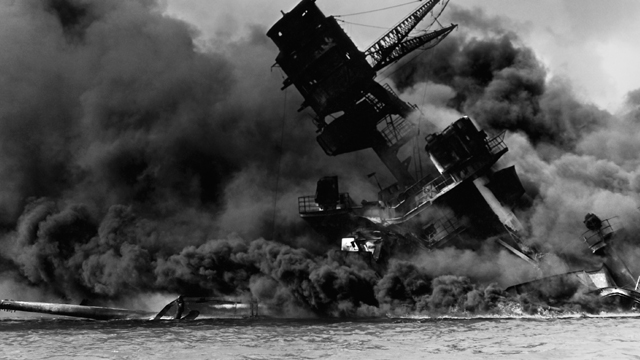 The USS Arizona burning after the Japanese attack on Pearl Harbor on December 7, 1941.