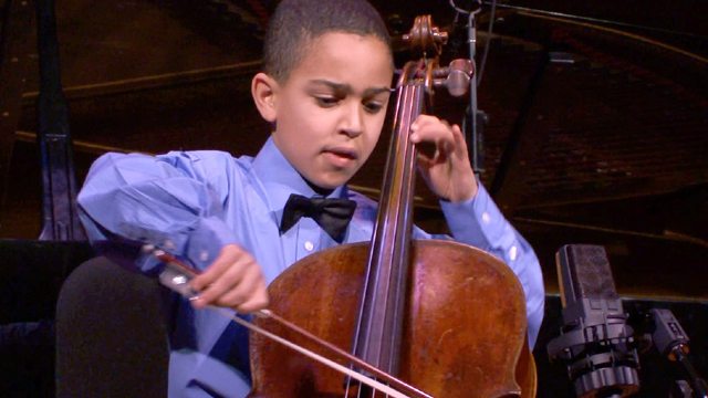Musical prodigy and cellist Lev Mamuya performs at a recital.