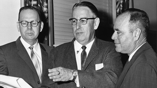 Committee Chairman Charley Johns (center)