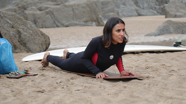 Anita gets a surfing lesson on Devon's beaches