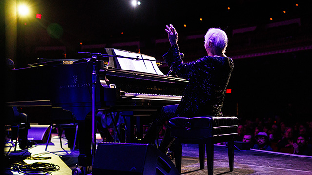 Folk singer Judy Collins at the piano